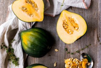 green and yellow squash on brown surface