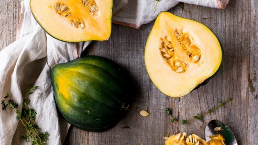 green and yellow squash on brown surface