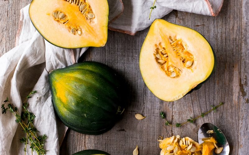 green and yellow squash on brown surface